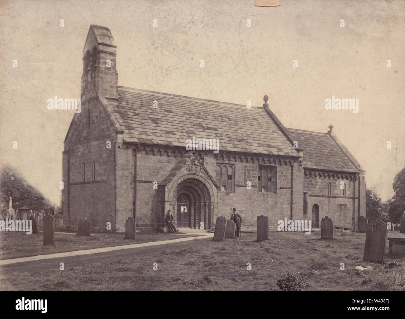 Victorian Photograph of Two Gentlemen Stood Outside The Church of Saint John the Baptist in Adel, Leeds, West Yorkshire, England. Stock Photo
