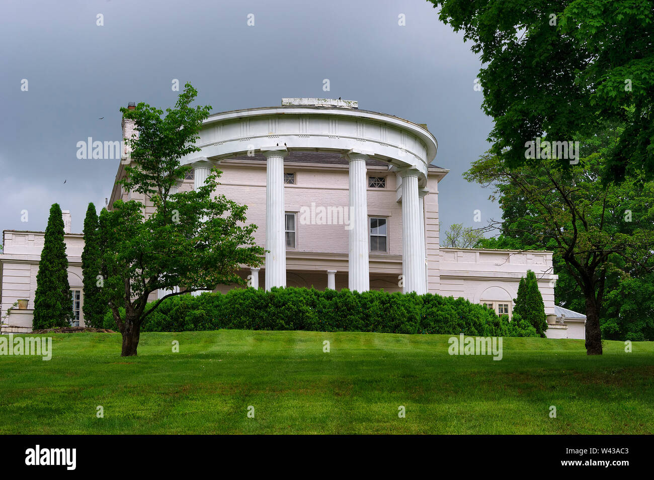 Saltville,Virginia,USA - May 11, 2019:  The front of a beautiful mansion and it manicured lawn seen from a country road in rural Virginia in the Appal Stock Photo