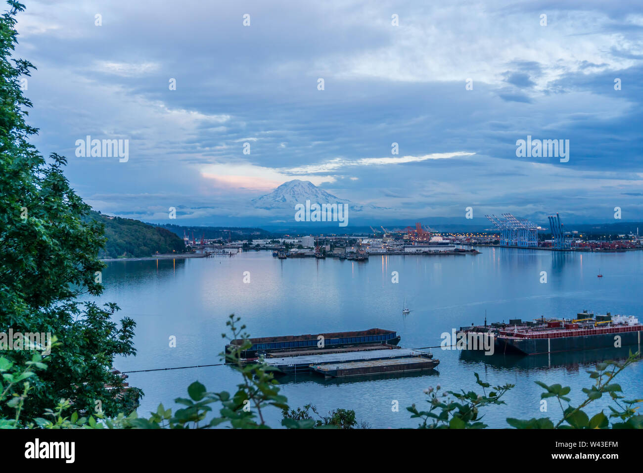 A view of Mount Rainier and the Port of Tacoma at twilight Stock Photo ...
