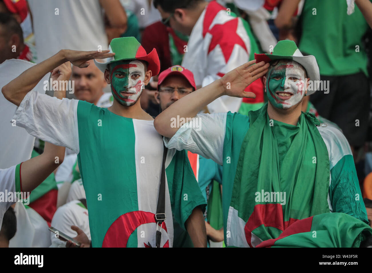 Cairo, Egypt. 19th July, 2019. Algerian fans cheer in the stands prior to the start of the 2019 Africa Cup of Nations final soccer match between Senegal and Algeria at the Cairo International Stadium. Credit: Oliver Weiken/dpa/Alamy Live News Stock Photo