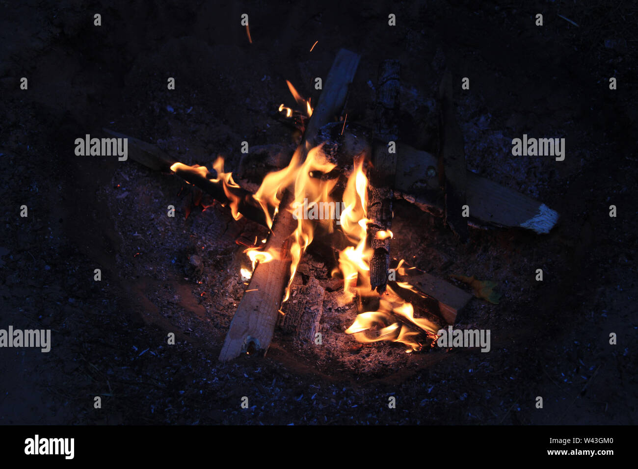 A bonfire in a forest at the night. The summer tourism camp Stock Photo ...