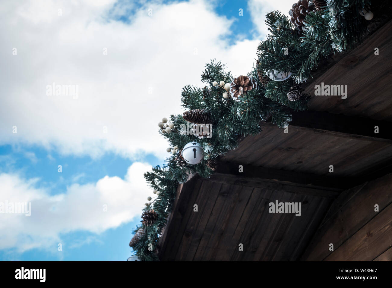 Christmas decorations on roof of wooden hut Stock Photo