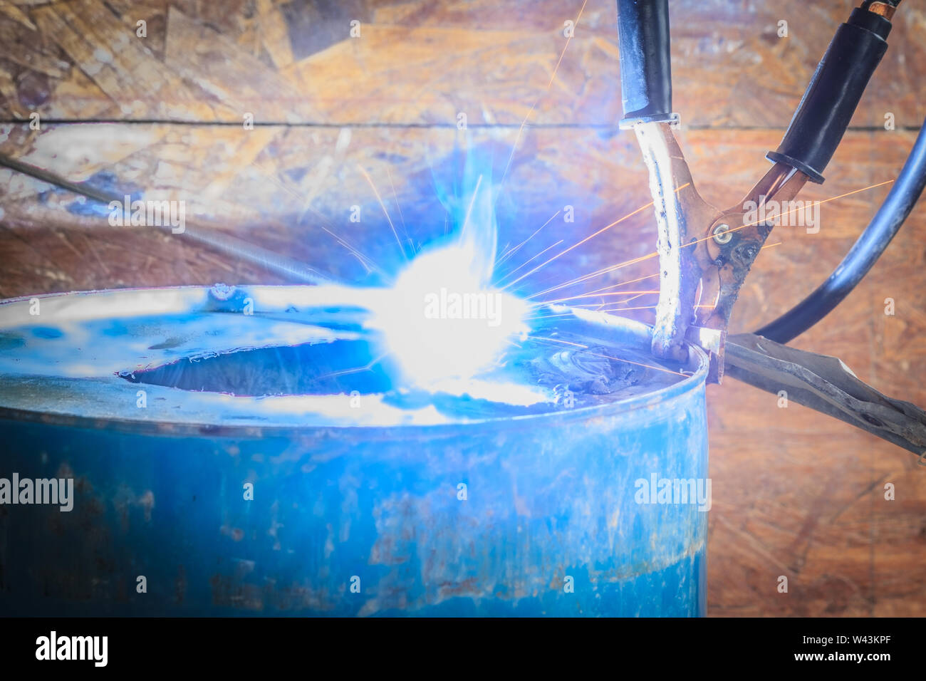 Spark light with welding Process with blue tube metal and bright sparks in steel Stock Photo