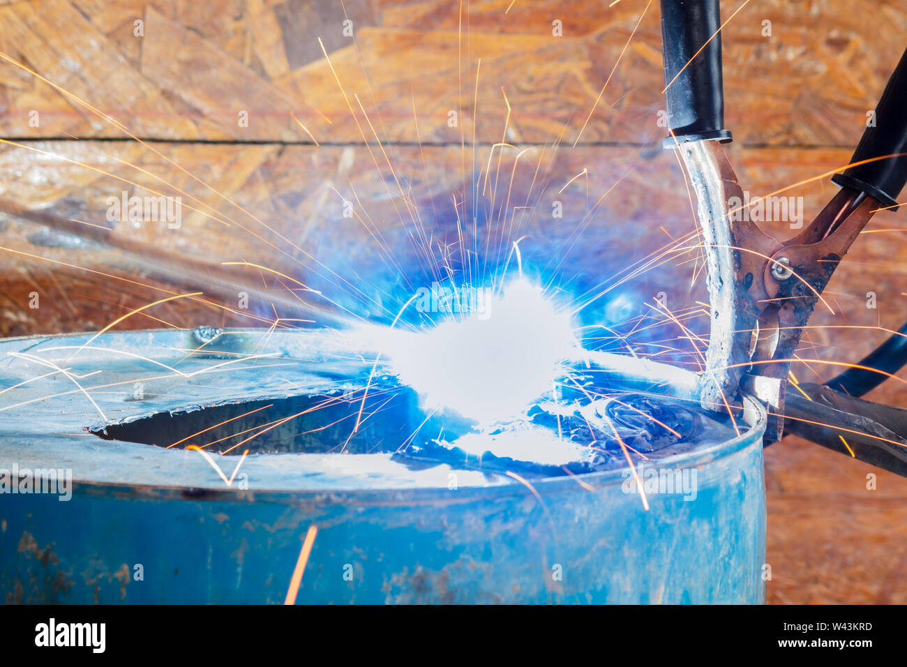 Spark light with welding Process with blue tube metal and bright sparks in steel Stock Photo Alamy