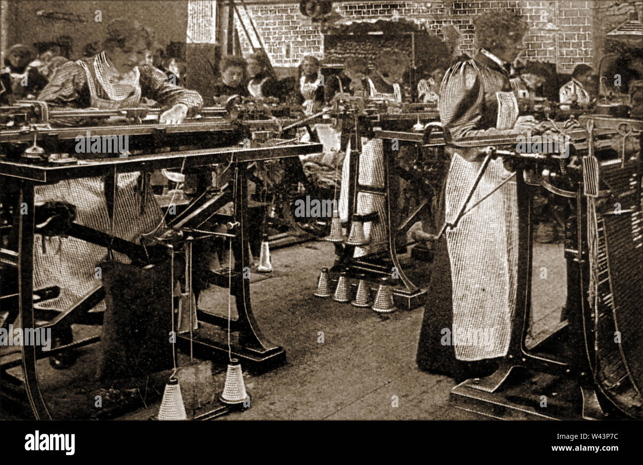 Making hosiery in a British woolen mill 1922 Stock Photo