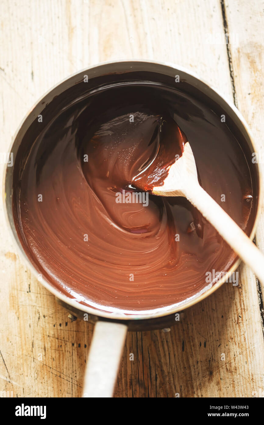 Preparing chocolate sauce in pot Stock Photo
