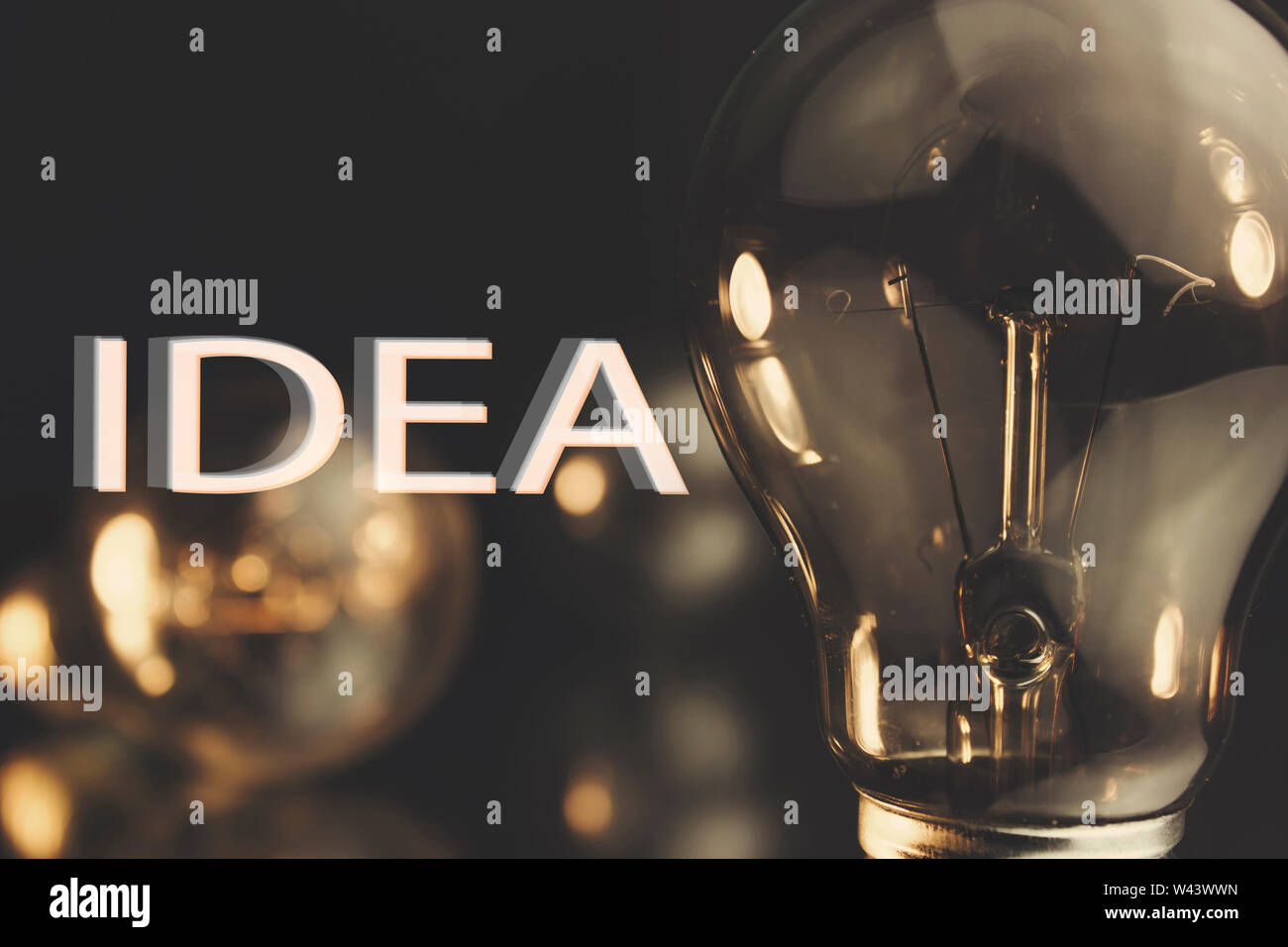 Light bulb shining in the darkness Stock Photo