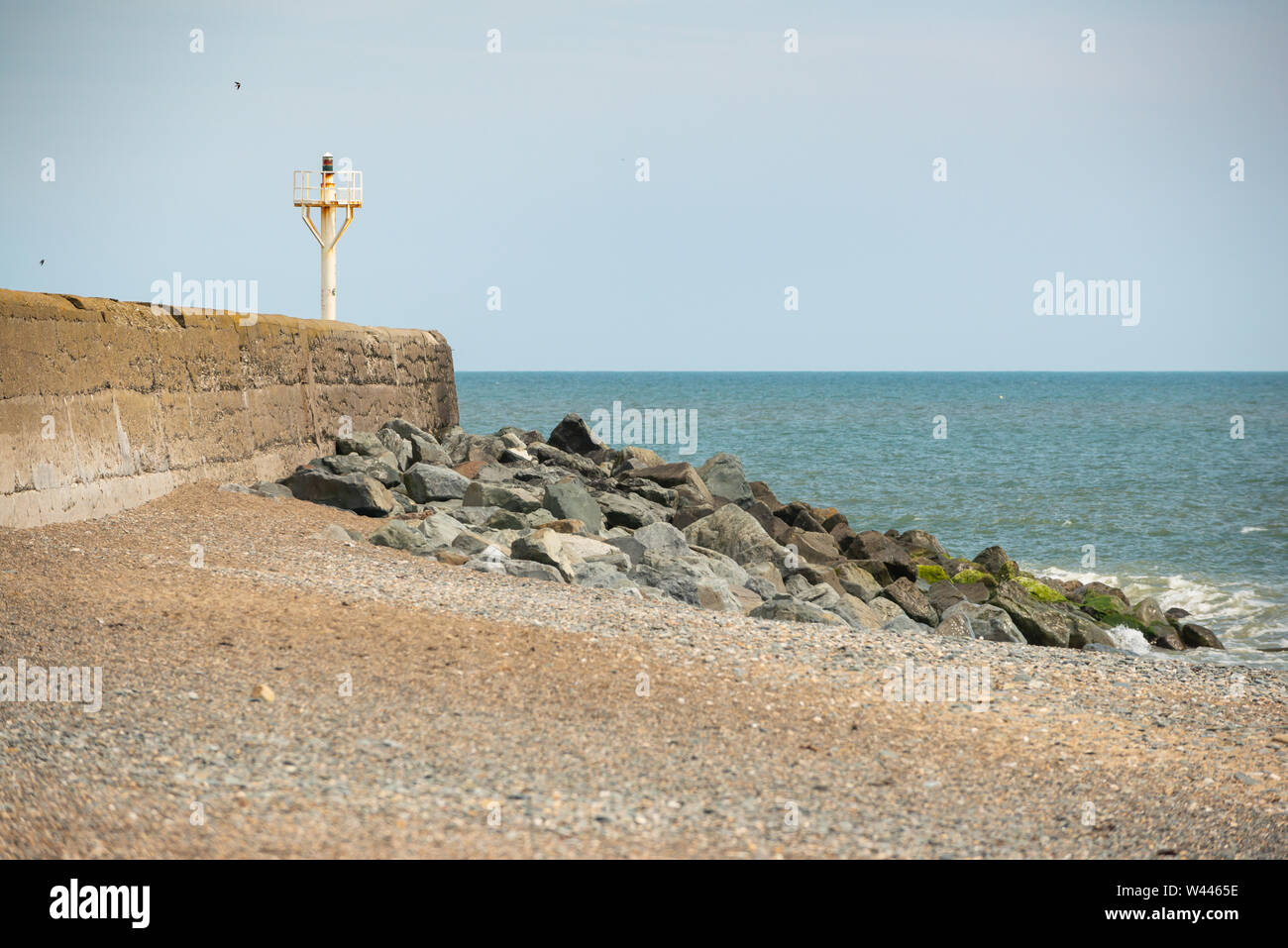 Breakwater with lighthouse at Arklow Stock Photo