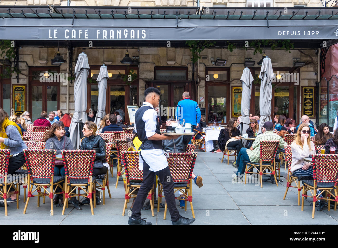 Bordeaux, France - May 5, 2019: A people relax in Cafe Francais on Place Pey Berland in Bordeaux, Aquitaine, France Stock Photo