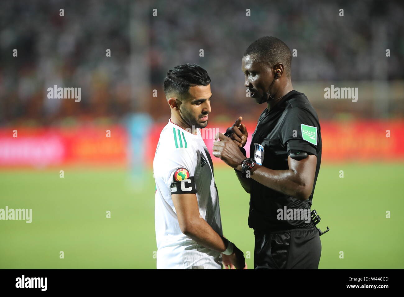 Cairo, Egypt. 19th July, 2019. Algeria's Riyad Mahrez speaks with the referee during the 2019 Africa Cup of Nations final soccer match between Senegal and Algeria at the Cairo International Stadium. Credit: Omar Zoheiry/dpa/Alamy Live News Stock Photo