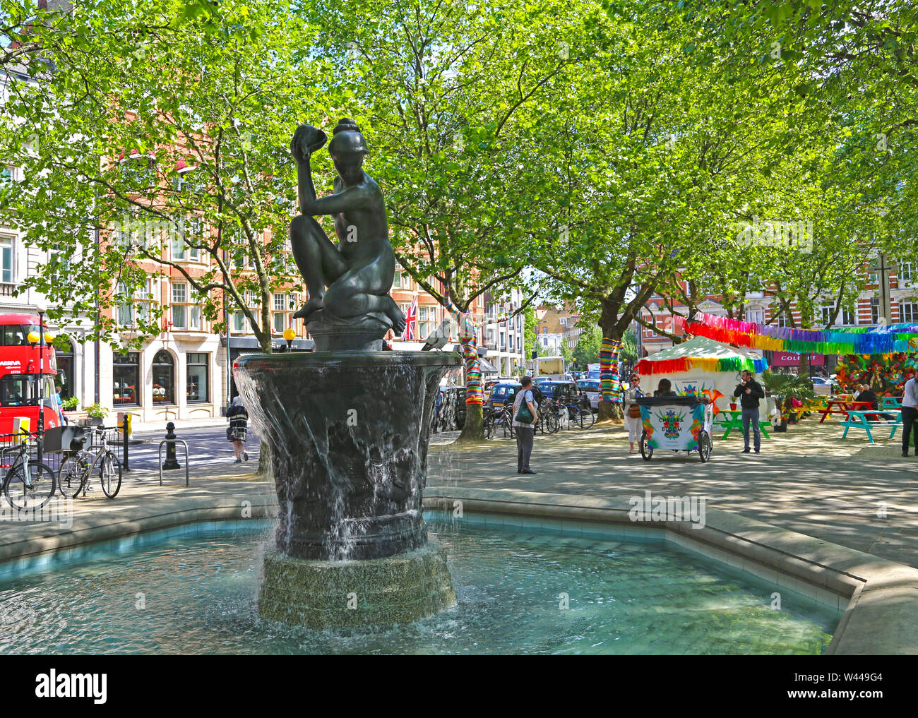 London, Great Britain -May 26, 2016: Chelsea, fountain in Sloane Square and information point of the flower show Stock Photo