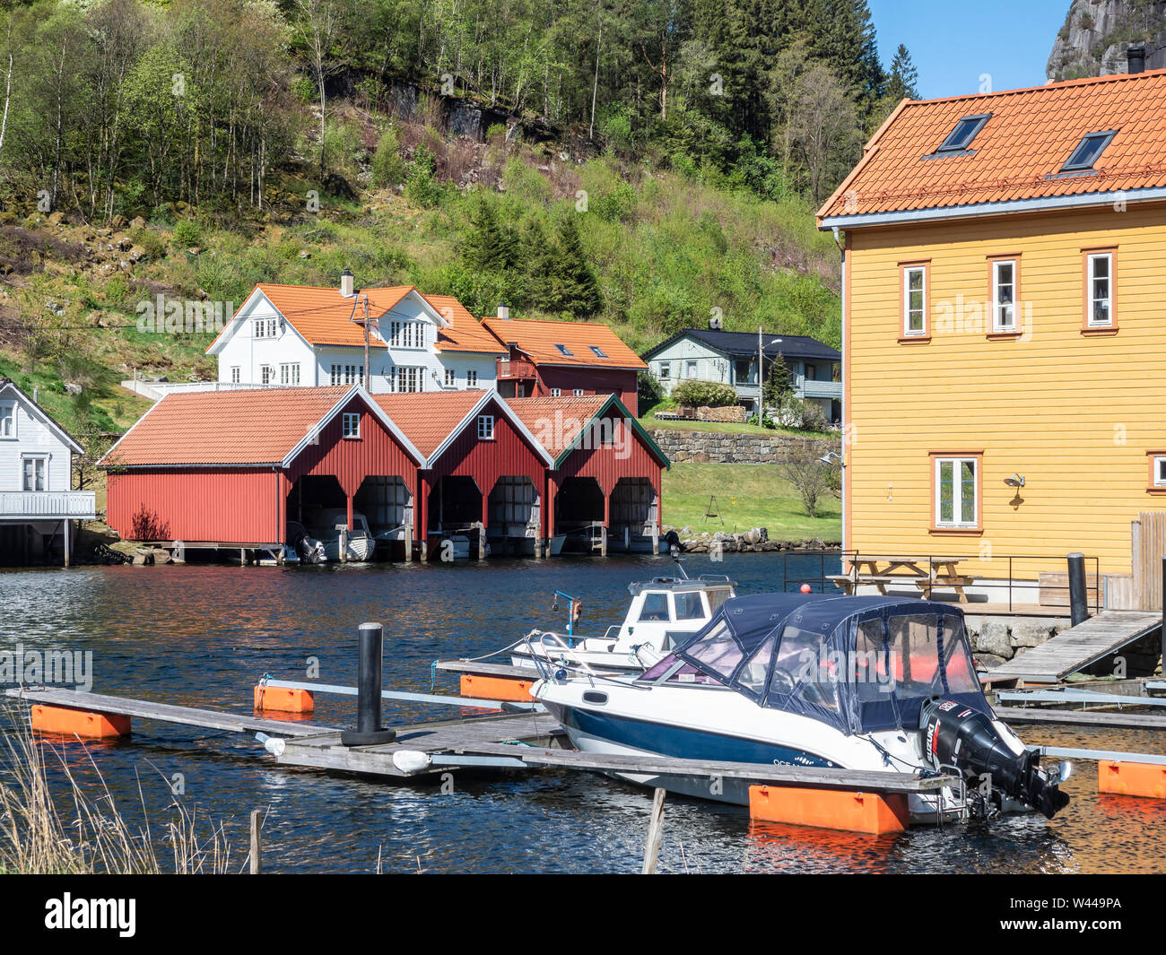 Leisure  boats at the Feda river, village Feda at the Fedafjord, southern  coast, fjordland, Norway Stock Photo