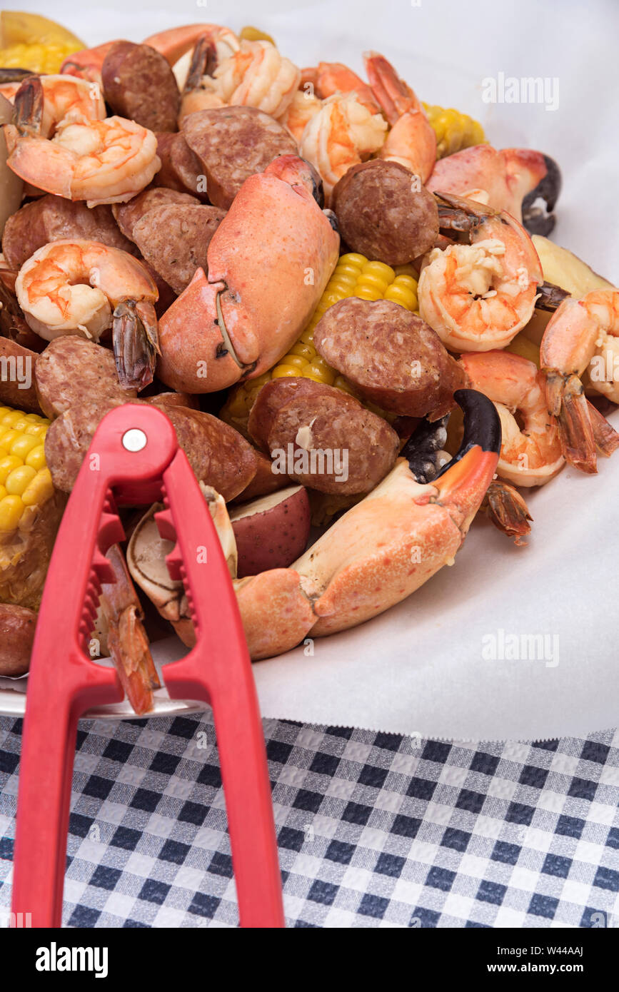 Crab boil platter with corn, sausage, crab, shrimp and potato with a