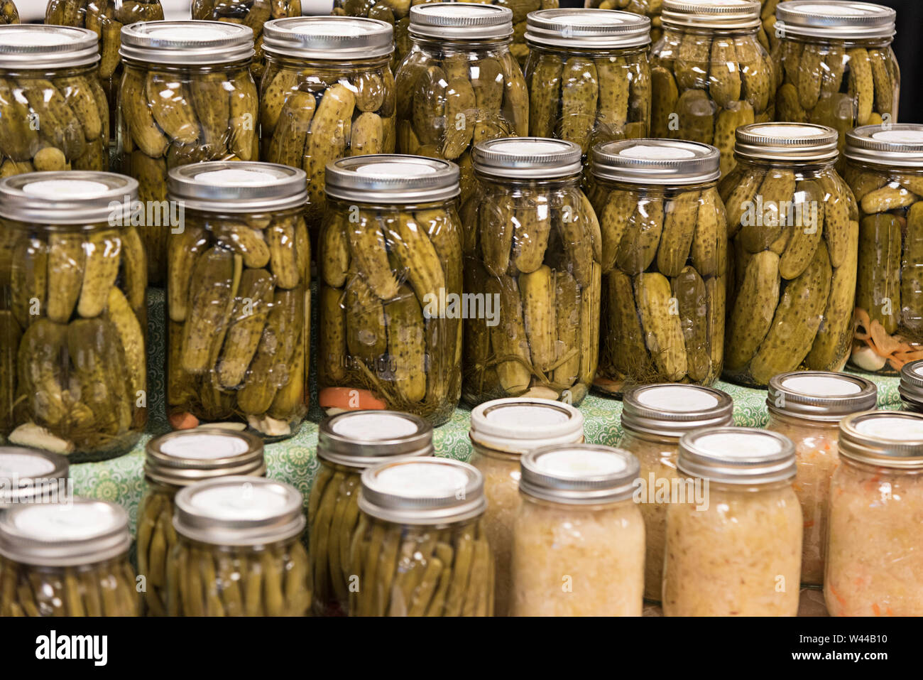 Homemade bottled pickles and pickled vegetables at a farmers' market