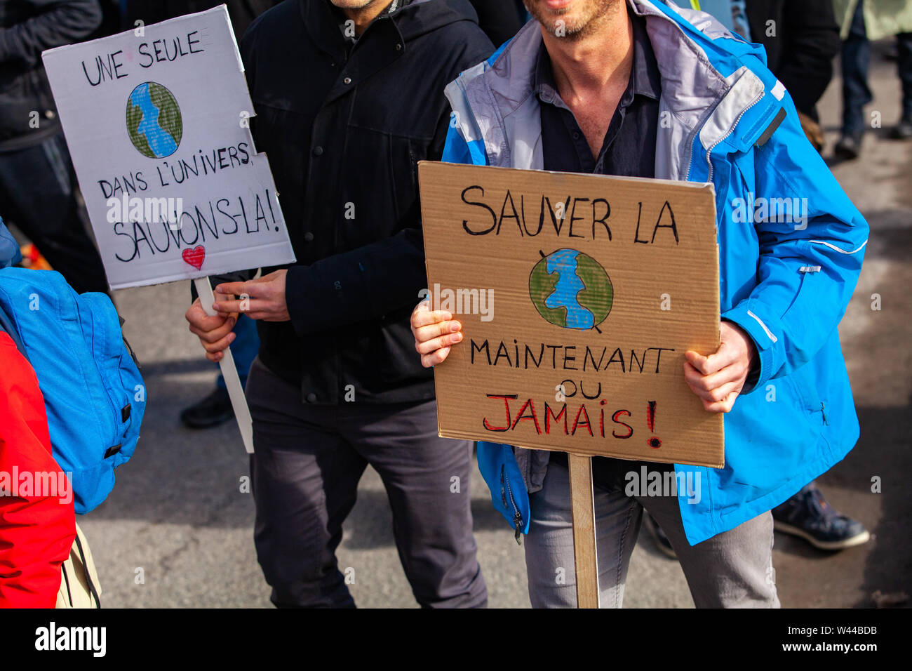 Demonstration Only A closeup view of two French signs saying only one in the universe save ...