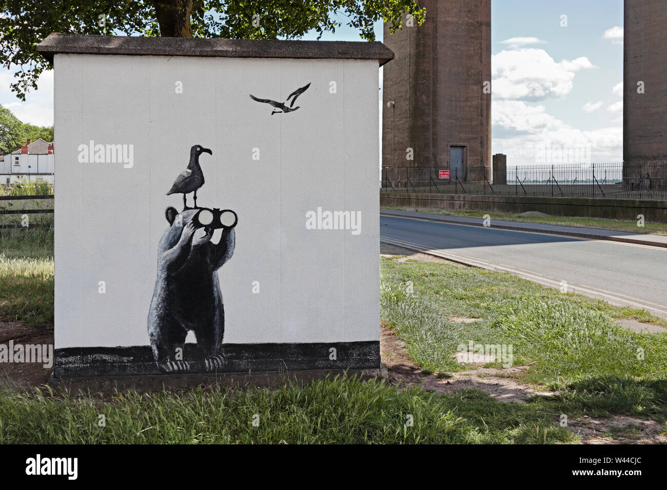 A utilities kiosk on the Hessle Foreshore to the side of the Humber Rescue Boathouse with a Look Out bear and Seagulls painted on the side. Stock Photo