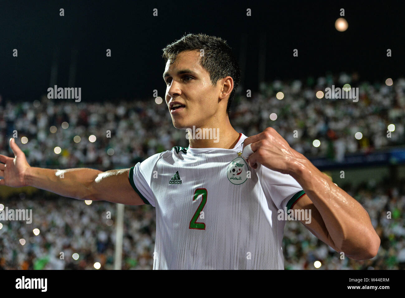 Cairo. 19th July, 2019. Aissa Mandi of Algeria celebrates the victory after the 2019 Africa Cup of Nations final match between Senegal and Algeria in Cairo, Egypt on July 19, 2019. Algeria won 1-0 and claimed the title. Credit: Li Yan/Xinhua/Alamy Live News Stock Photo