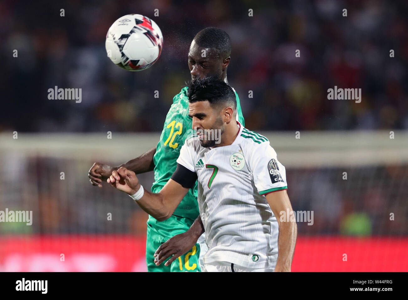 Cairo. 19th July, 2019. Algeria's Riyad Mahrez (R) vies with Senegal's Youssouf Sabaly during the 2019 Africa Cup of Nations final match between Senegal and Algeria in Cairo, Egypt on July 19, 2019. Algeria won 1-0 and claimed the title. Credit: Ahmed Gomaa/Xinhua/Alamy Live News Stock Photo