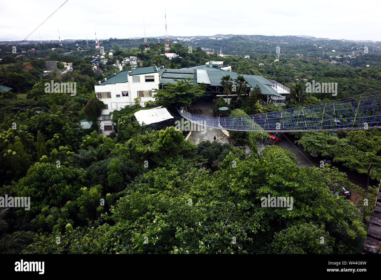 ANTIPOLO CITY, PHILIPPINES – JULY 17, 2019: Hanging bridge which leads to a 360 degree viewing deck at a restaurant and tourist destination in Antipol Stock Photo