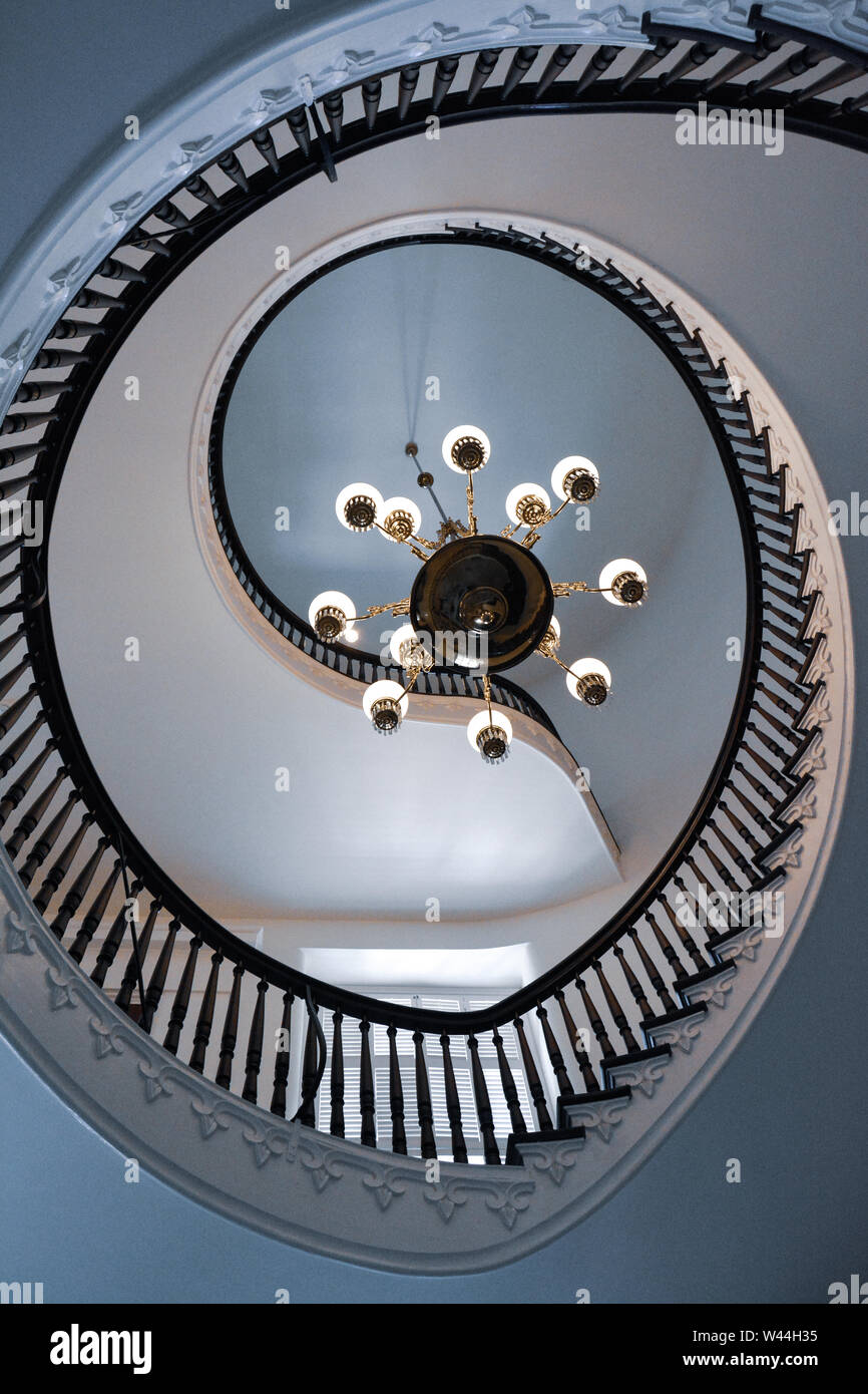 View of a Beautiful cantilevered spiral staircase with a chandlier inside the historic Alabama State Capitol building in Montgomery, AL, USA Stock Photo