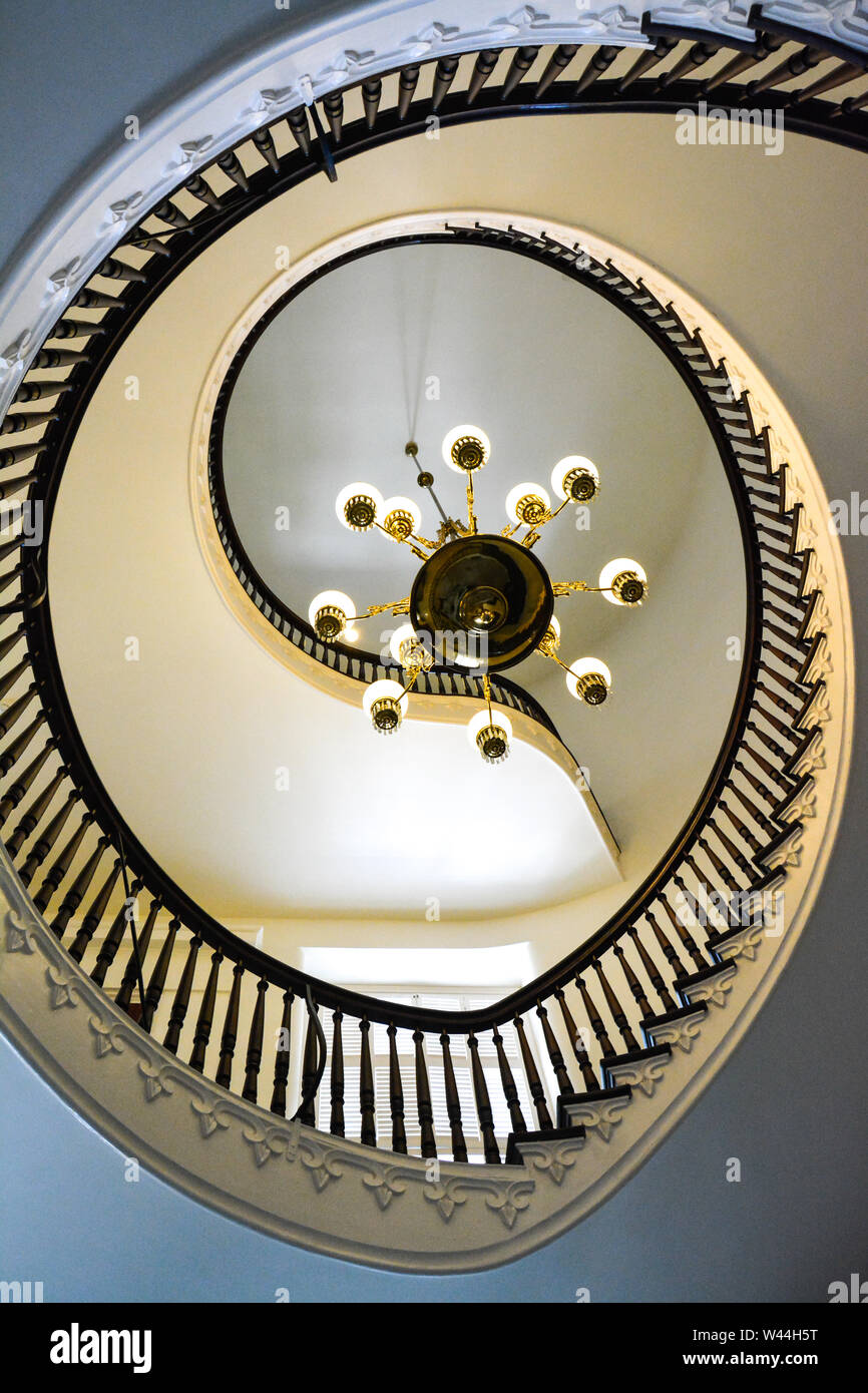 View of a Beautiful cantilevered spiral staircase with a chandlier inside the historic Alabama State Capitol building in Montgomery, AL, USA Stock Photo