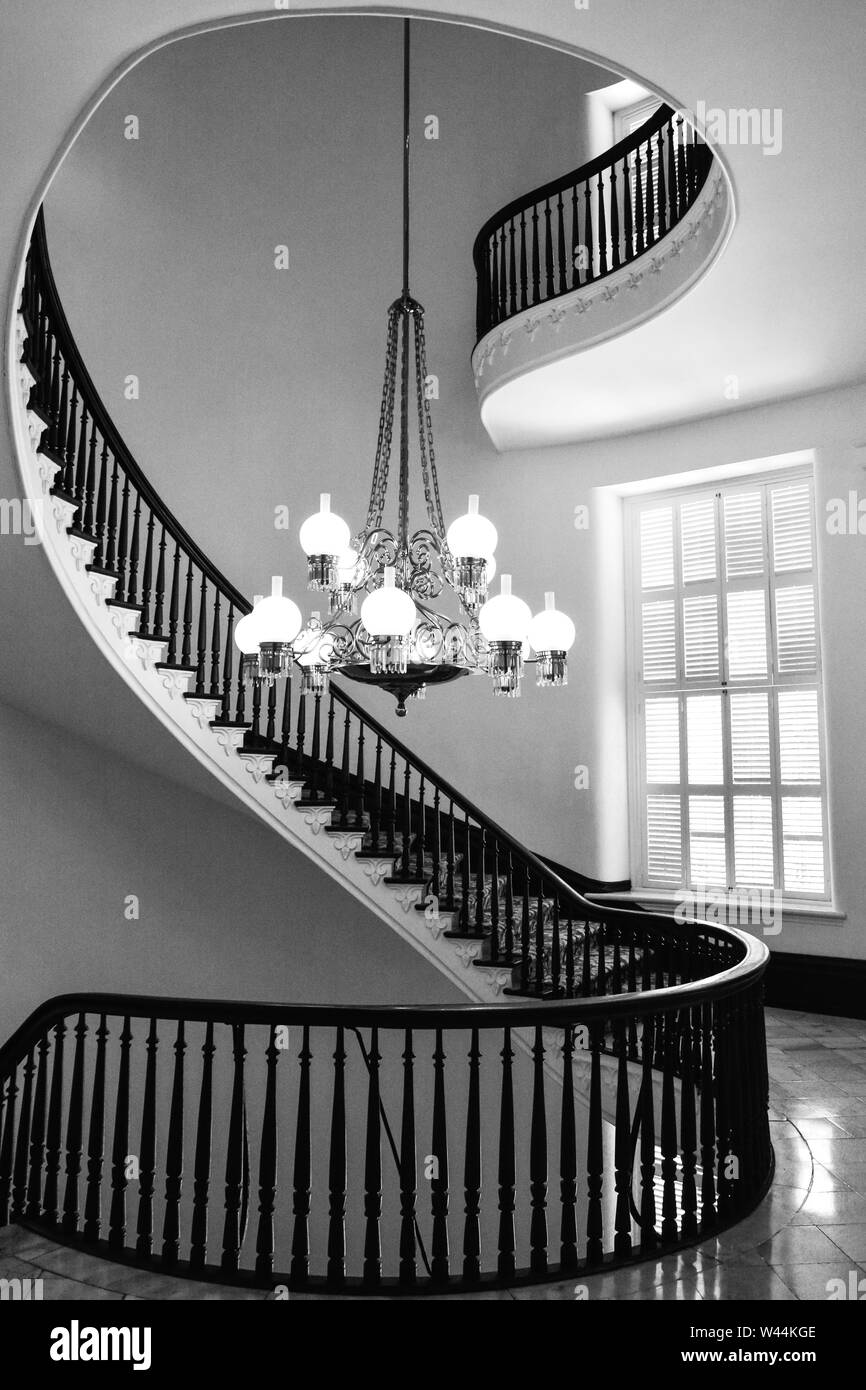 View of a Beautiful cantilevered spiral staircase with a chandelier inside the historic Alabama State Capitol building in Montgomery, AL, USA Stock Photo