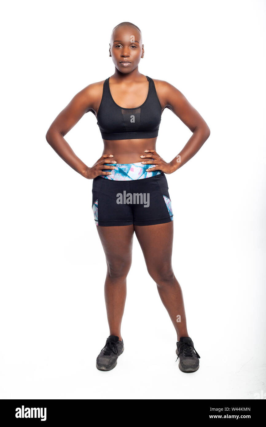Athletic African American black female wearing workout clothing. Her sporty  outfit is a sports bra and form fitting spandex shorts. She looks strong  Stock Photo - Alamy
