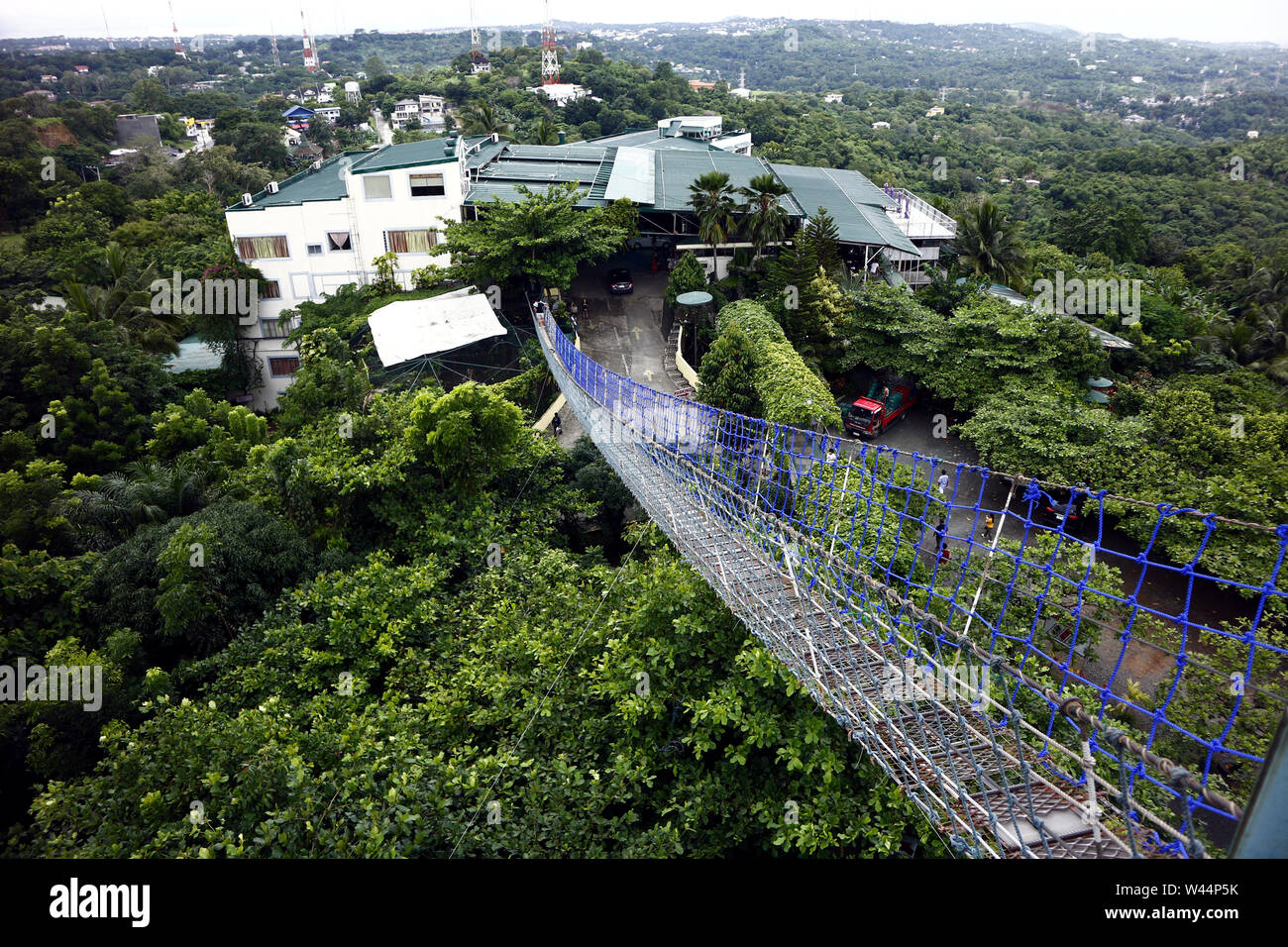 ANTIPOLO CITY, PHILIPPINES – JULY 17, 2019: Hanging bridge which leads to a 360 degree viewing deck at a restaurant and tourist destination in Antipol Stock Photo