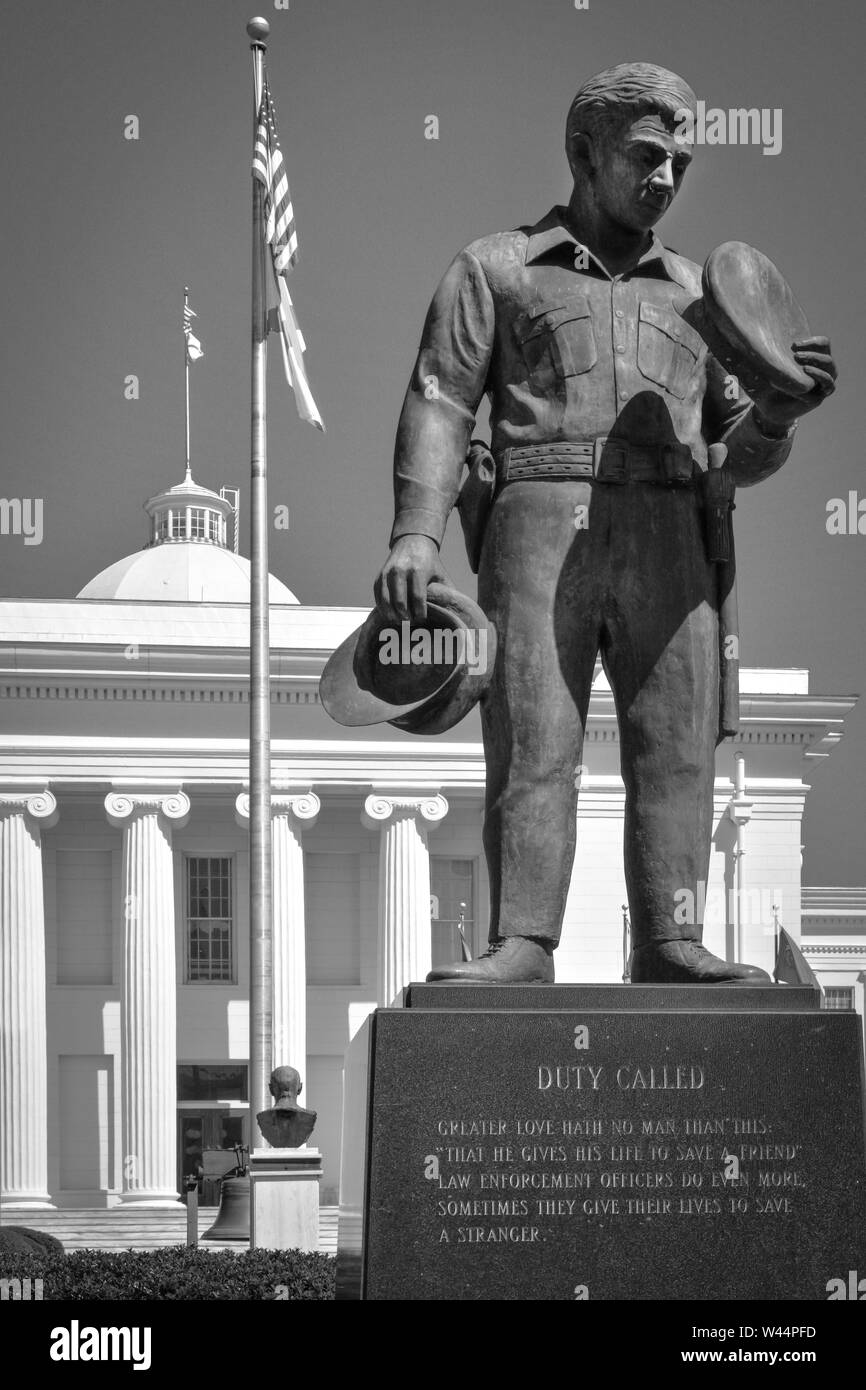 The 'Duty Called' bronze statue of a law enforcement officer before the Southeast entrance to the historical Alabama State Capitol, Montgomery, AL Stock Photo