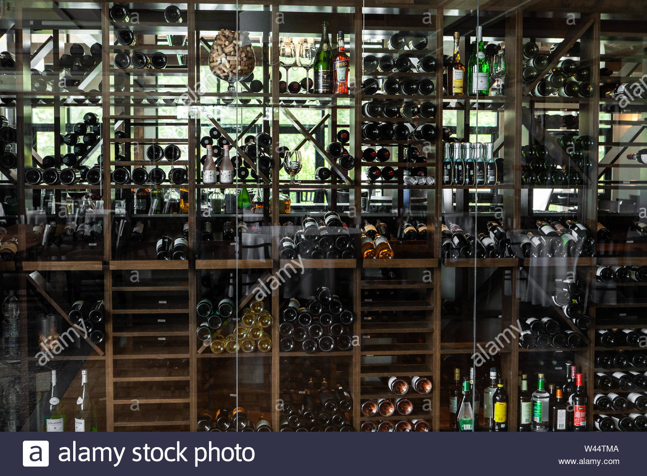 A Modern Wine Chiller Is Viewed Fully Stored With Bottles Inside