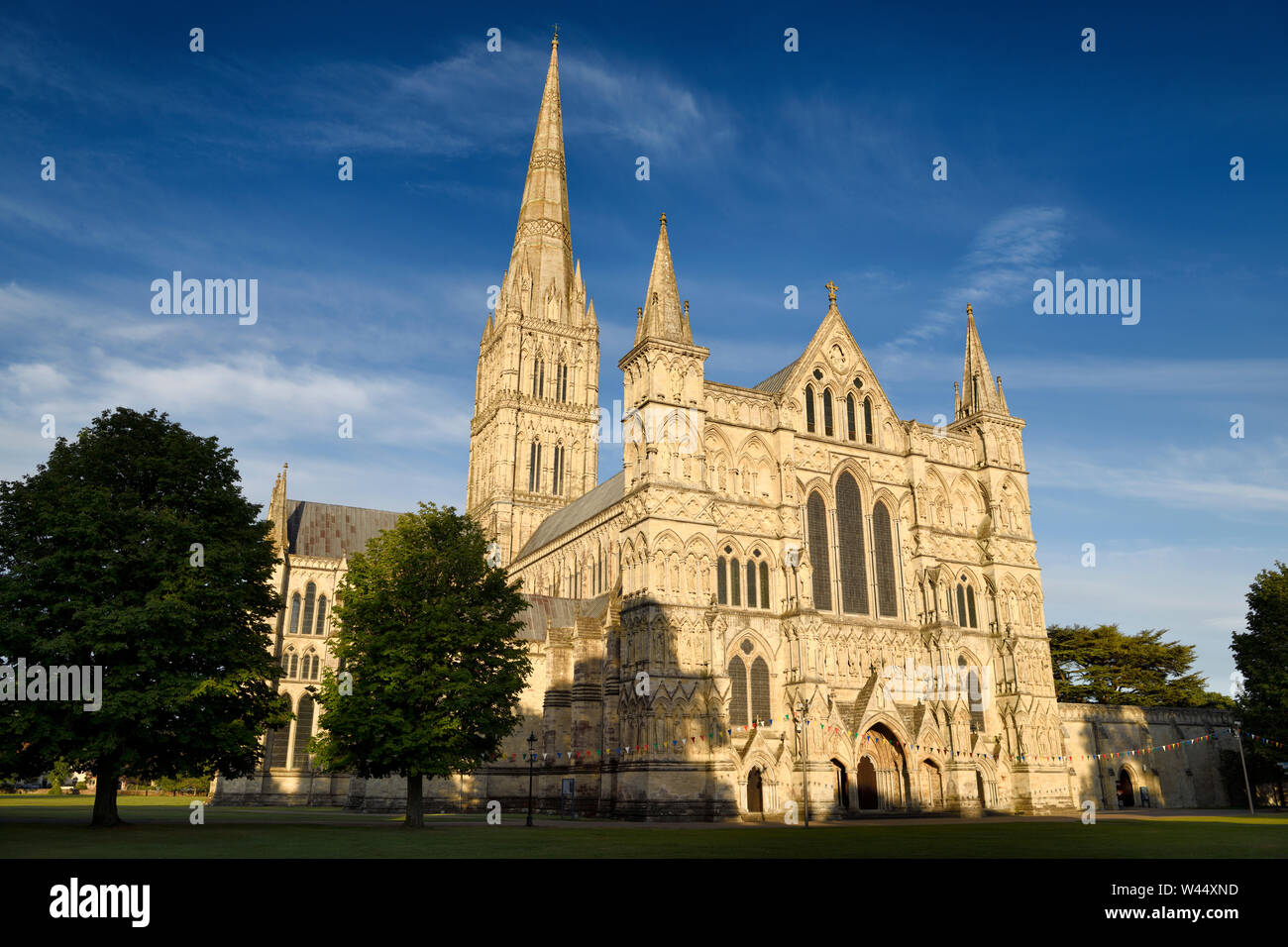 Great West Front facade of Salisbury Cathedral in late evening light in Salisbury England Stock Photo