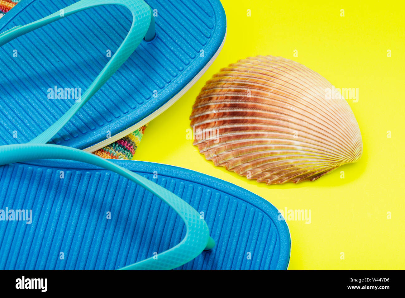 Folded Colorful Striped Organic Cotton Beach Towels, Blue Flip Flops ...