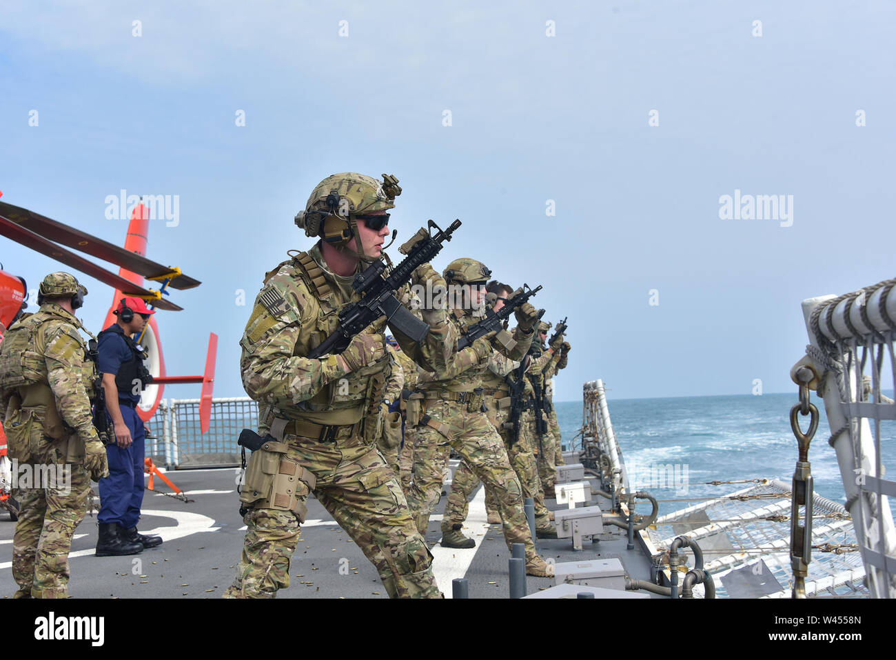 EAST CHINA SEA--Members of Maritime Security and Response Team West exercise with sidearms and rifles from the flight deck of U.S. Coast Guard Cutter Bertholf (WMSL 750) Feb. 25, 2019.   Bertholf is on a months-long deployment in support of the U.S. Navy's 7th Fleet. U.S. Coast Guard photo by Chief Petty Officer John Masson. Stock Photo
