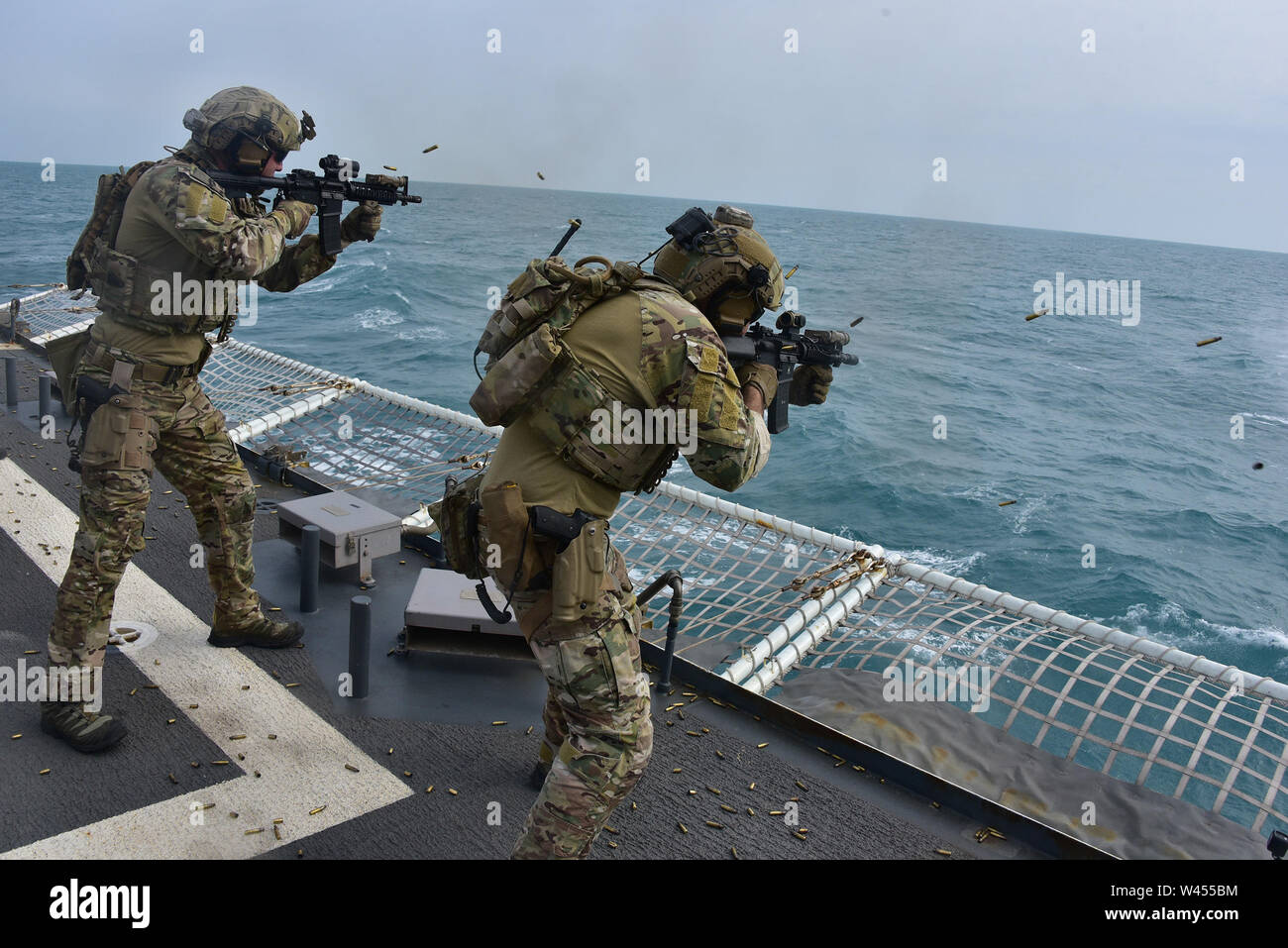 EAST CHINA SEA--Members of Maritime Security and Response Team West exercise with sidearms and rifles from the flight deck of U.S. Coast Guard Cutter Bertholf (WMSL 750) Feb. 25, 2019.   Bertholf is on a months-long deployment in support of the U.S. Navy's 7th Fleet. U.S. Coast Guard photo by Chief Petty Officer John Masson. Stock Photo