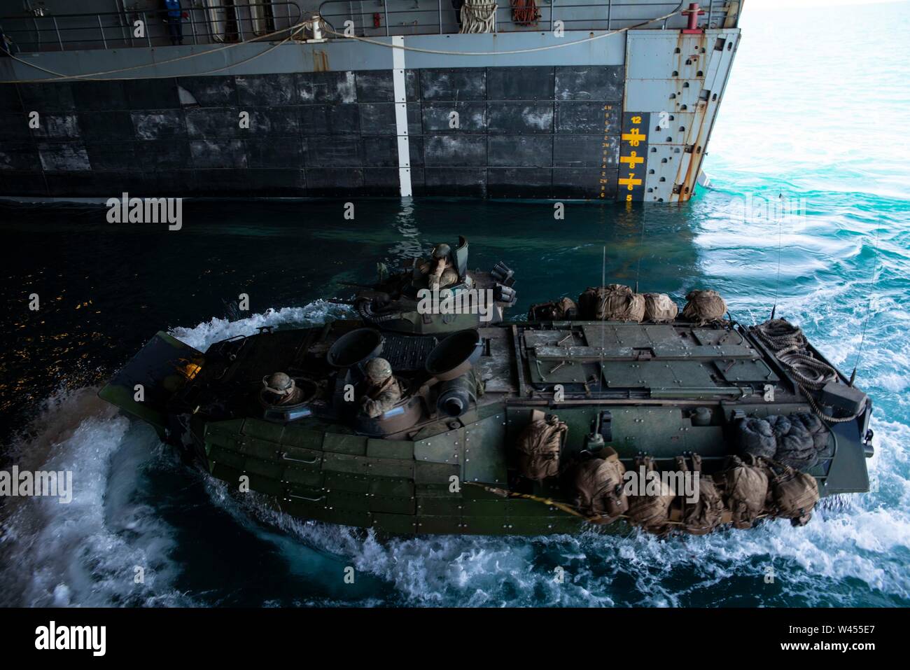 190718-N-DX072-1185 STANAGE BAY, Australia (July 18, 2019) An assault amphibious vehicle (AAV), assigned to the 31st Marine Expeditionary Unit (MEU), enters the well deck of the amphibious transport dock ship USS Green Bay (LPD 20). Green Bay, part of the Wasp Expeditionary Strike Group, with embarked 31st MEU, is currently participating in Talisman Sabre 2019 off the coast of Northern Australia. A bilateral, biennial event, Talisman Sabre is designed to improve U.S. and Australian combat training, readiness and interoperability through realistic, relevant training necessary to maintain region Stock Photo