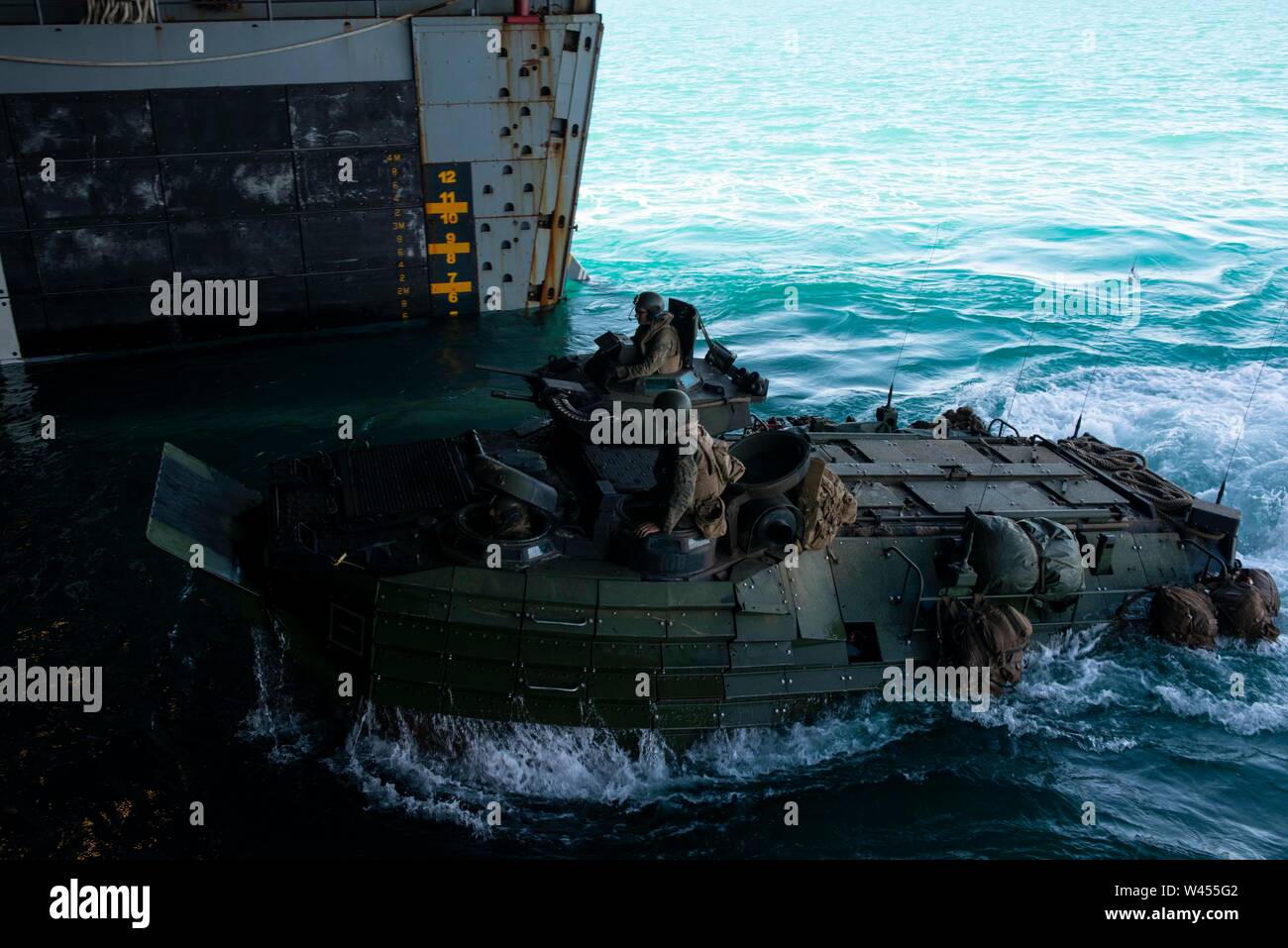 190718-N-DX072-1169 STANAGE BAY, Australia (July 18, 2019) An assault amphibious vehicle (AAV), assigned to the 31st Marine Expeditionary Unit (MEU), enters the well deck of the amphibious transport dock ship USS Green Bay (LPD 20). Green Bay, part of the Wasp Expeditionary Strike Group, with embarked 31st MEU, is currently participating in Talisman Sabre 2019 off the coast of Northern Australia. A bilateral, biennial event, Talisman Sabre is designed to improve U.S. and Australian combat training, readiness and interoperability through realistic, relevant training necessary to maintain region Stock Photo