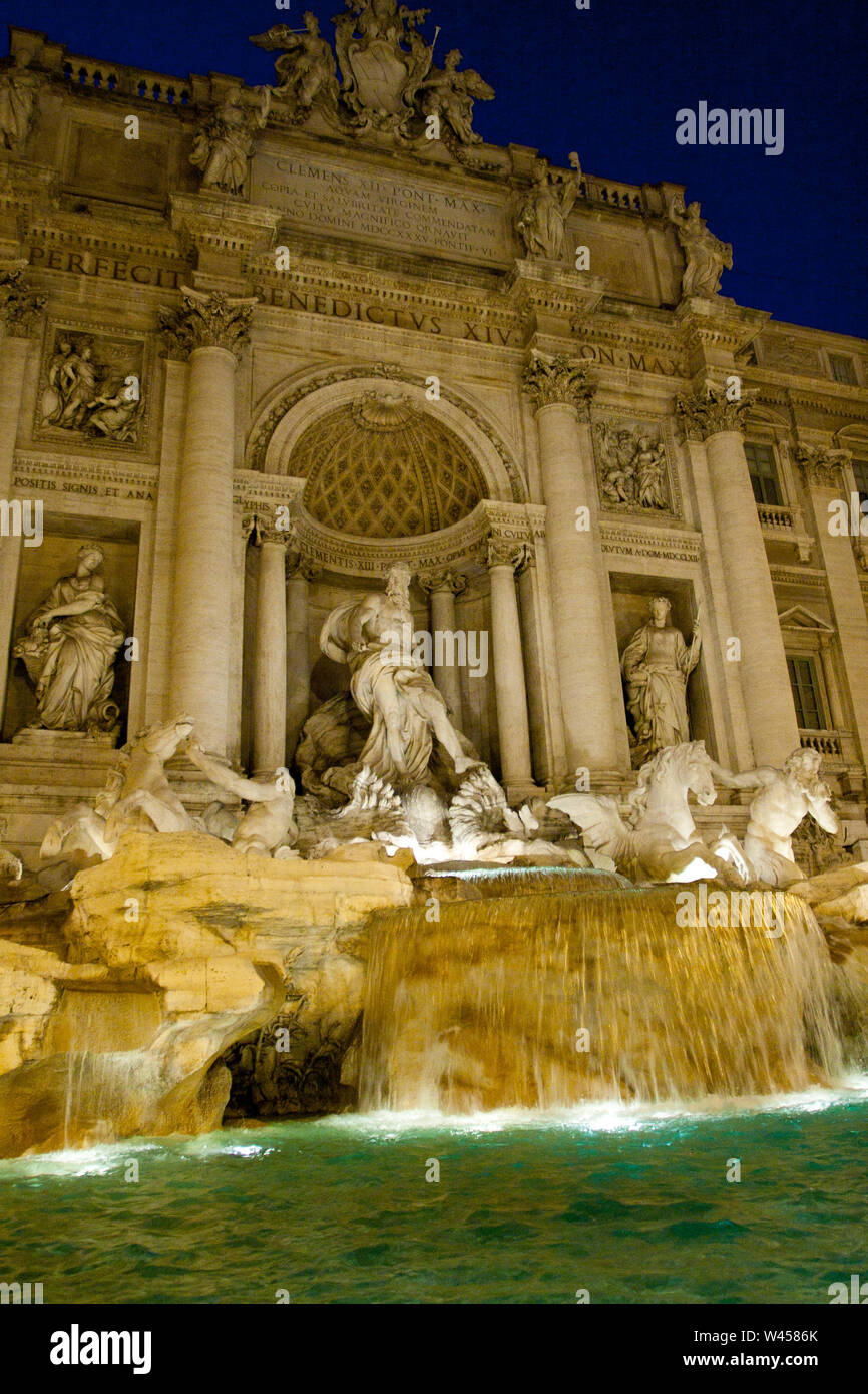 lit night Trevi Fountain in Rome Italy. Vertikal Stock Photo