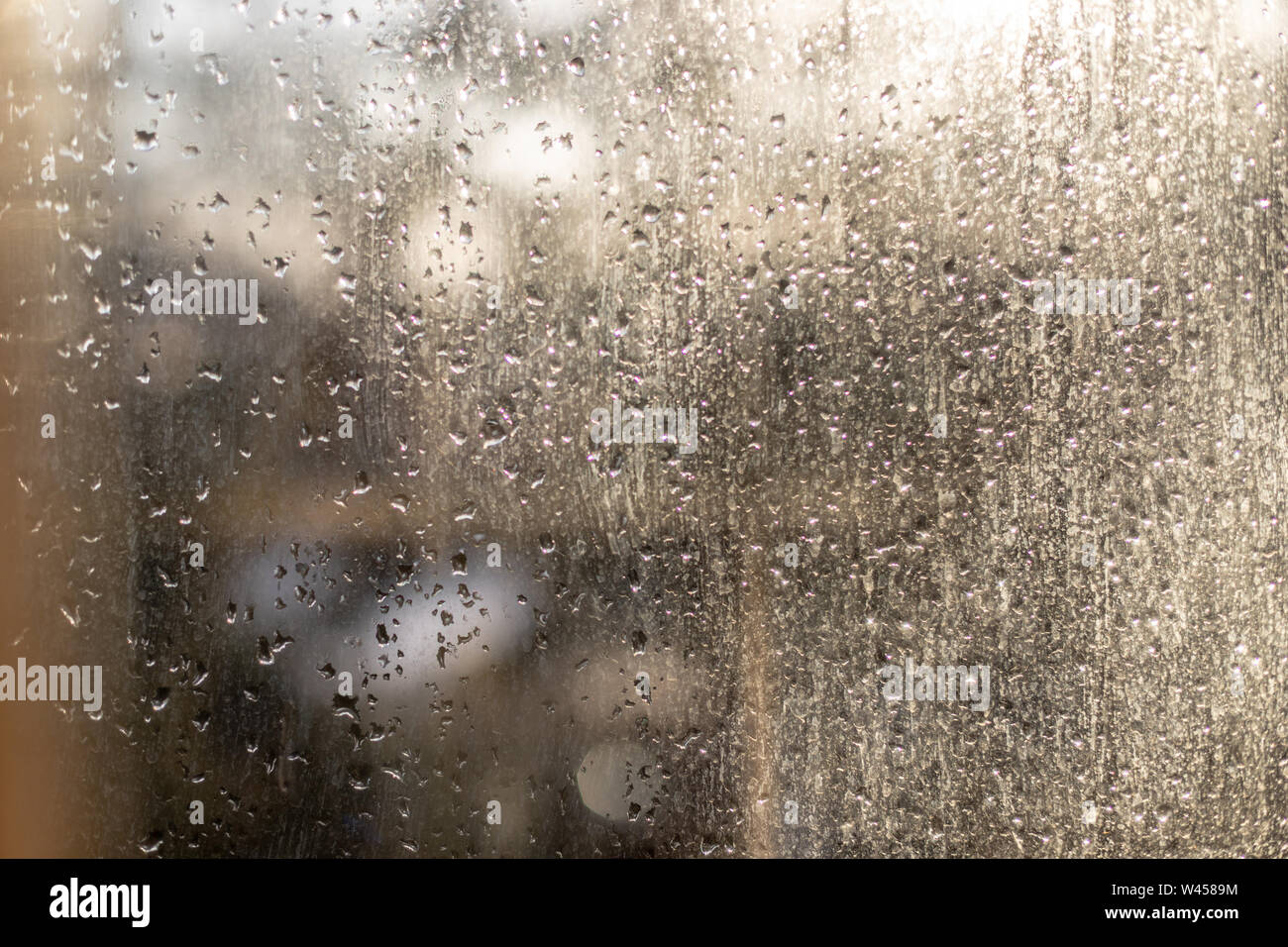 Drops of rain on the glass on a sunny morning. Rainy texture Stock ...