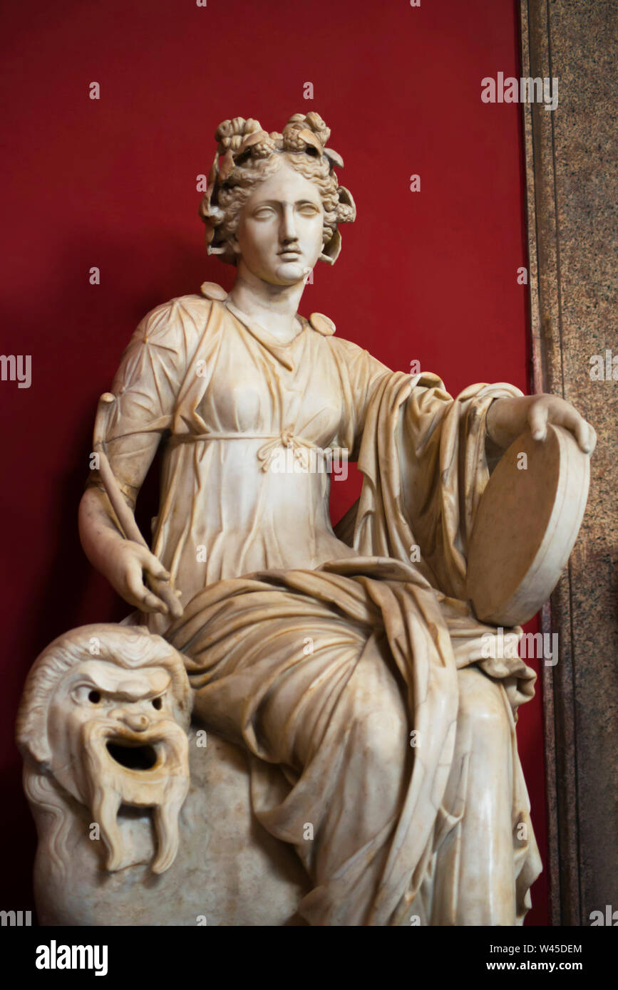 Female figure statue seated on a lion in a hear dress and holding