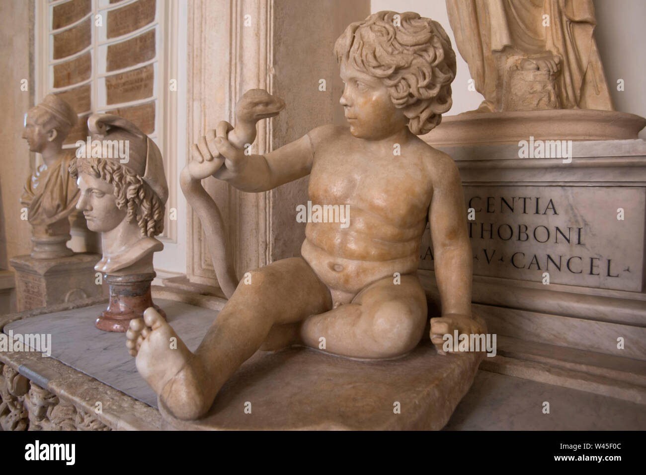 Herakles as a boy strangling a snake, Roman marble artwork, Capitoline Museum, Rome. Stock Photo