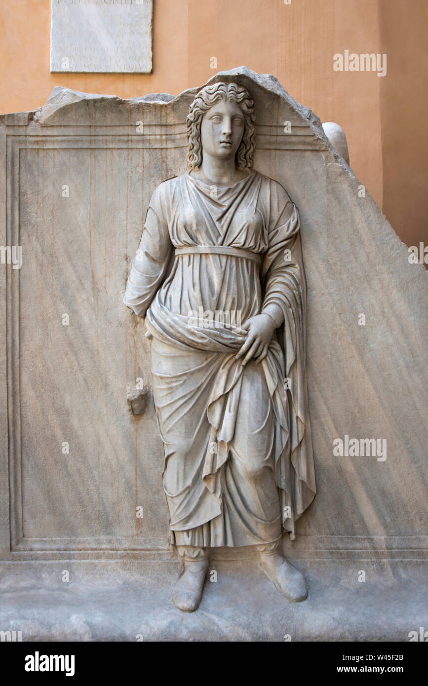 A statue of a roman lady wearing heavy clothing full of drapery, Capitoline Museum, Rome. Stock Photo