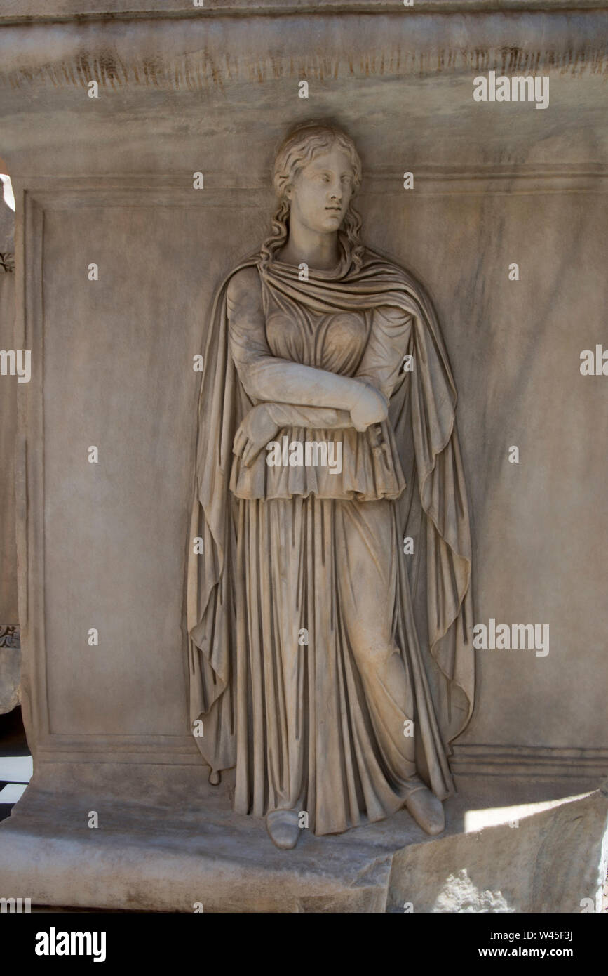 Statue of a roman girl wearing heavy clothing, Capitoline Museum, Rome. Stock Photo