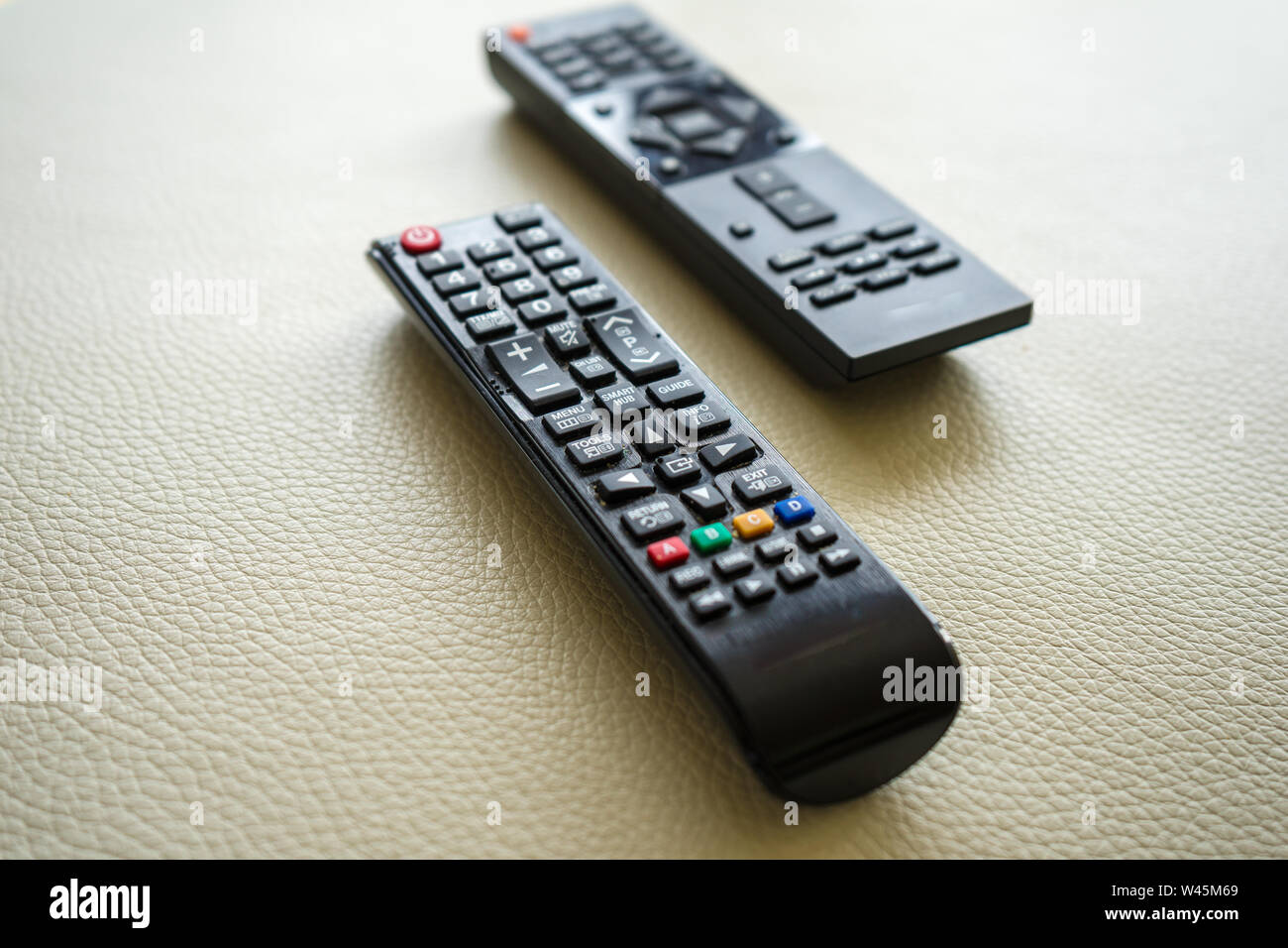 Two remote controller for digital experience on white background Stock ...
