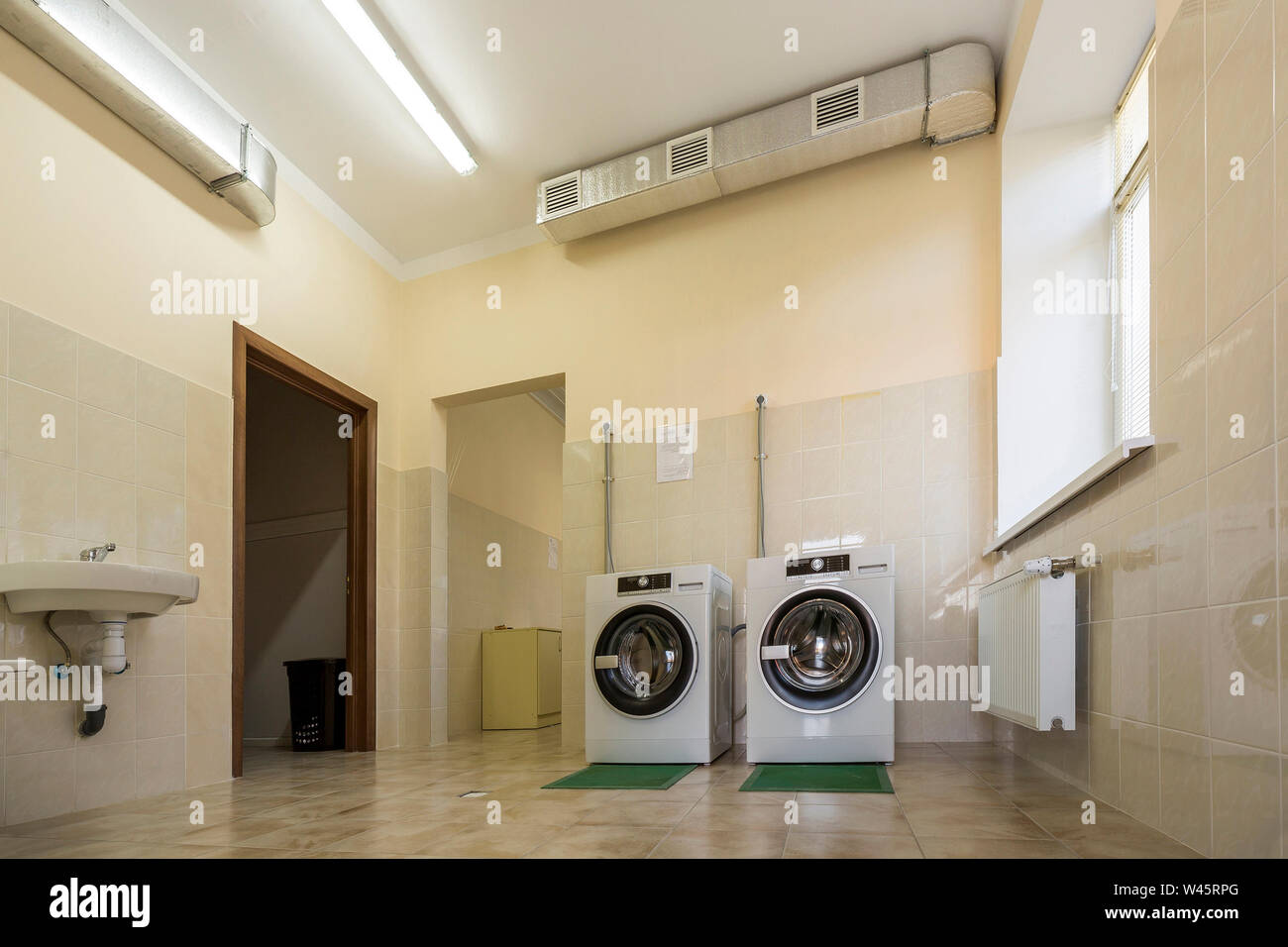 Modern New Industrial Washing Machines On Rubber Insulation Mats
