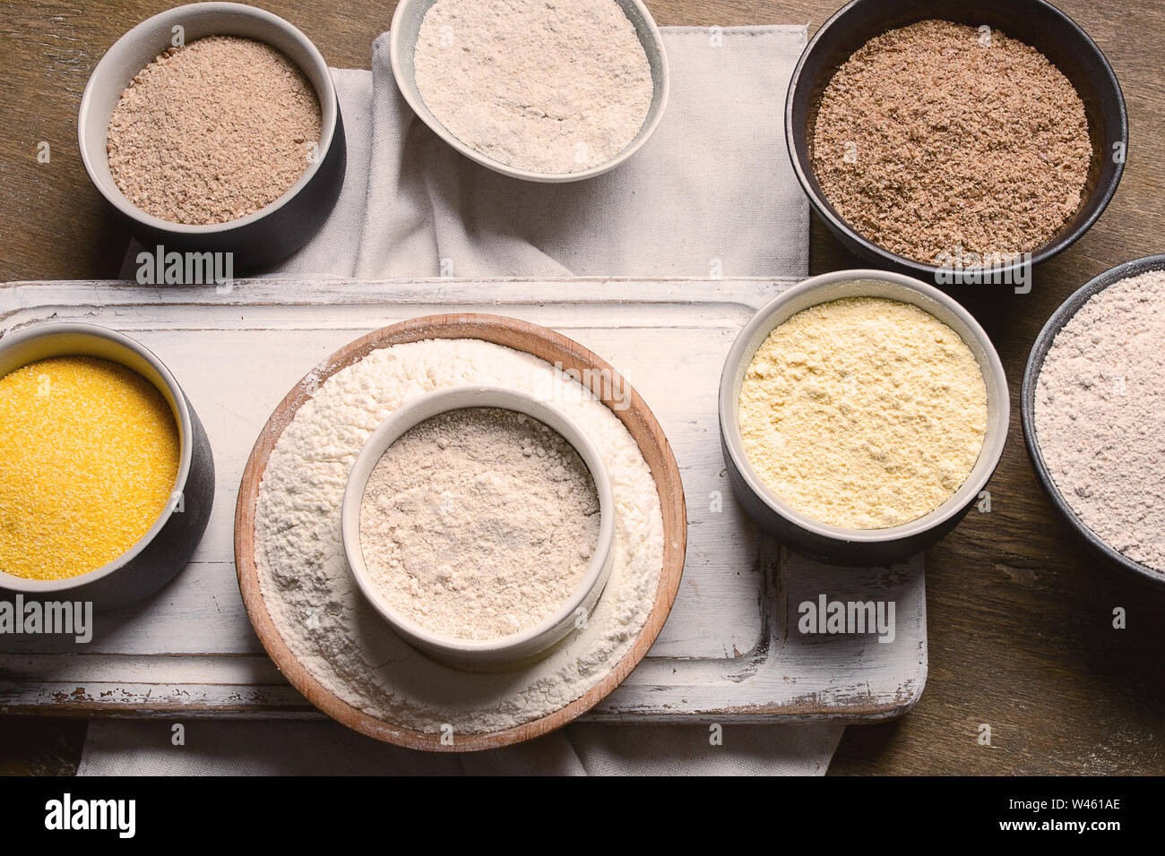 Different types of baking flour on wooden table Stock Photo Alamy