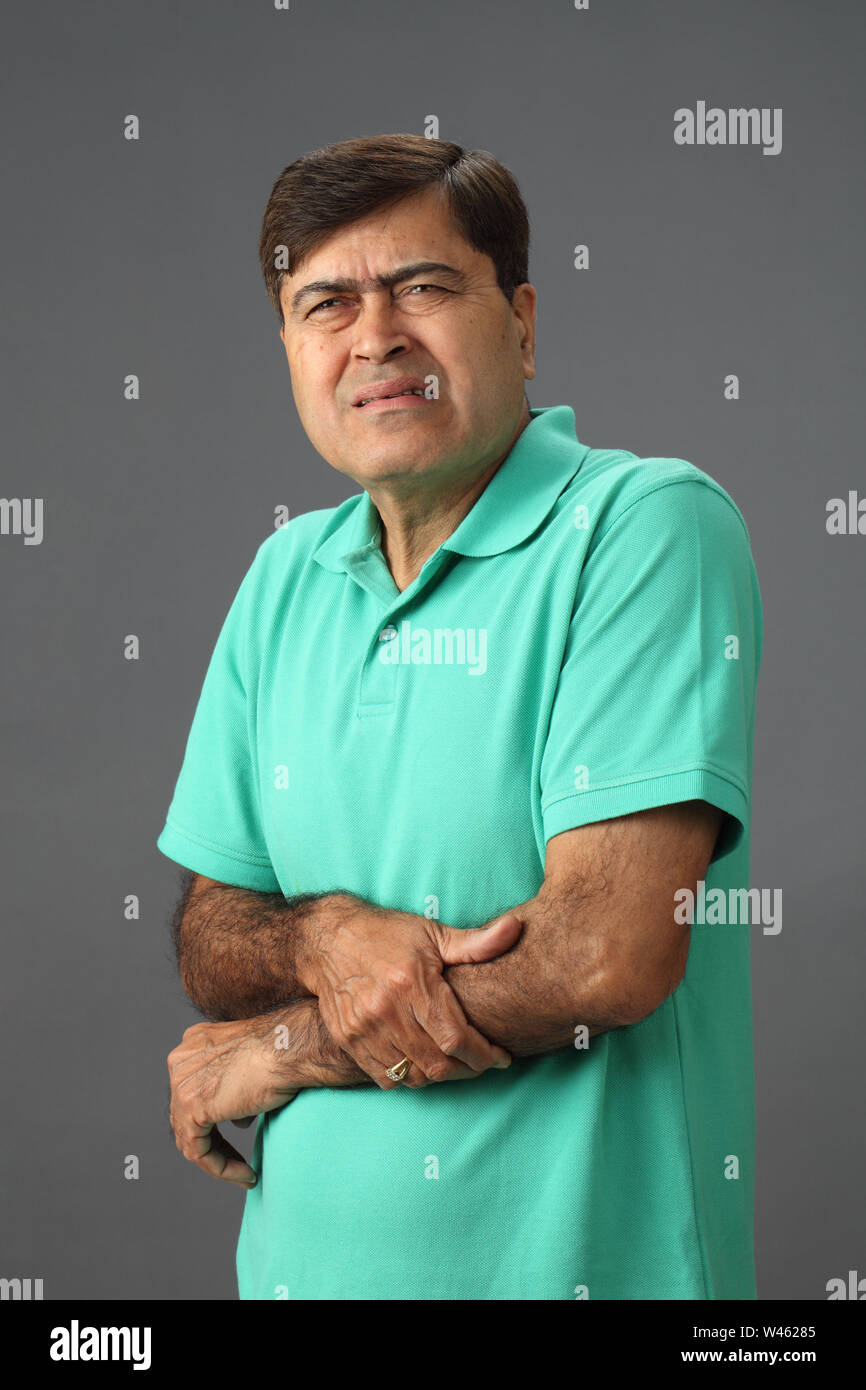 Man suffering from hand pain Stock Photo