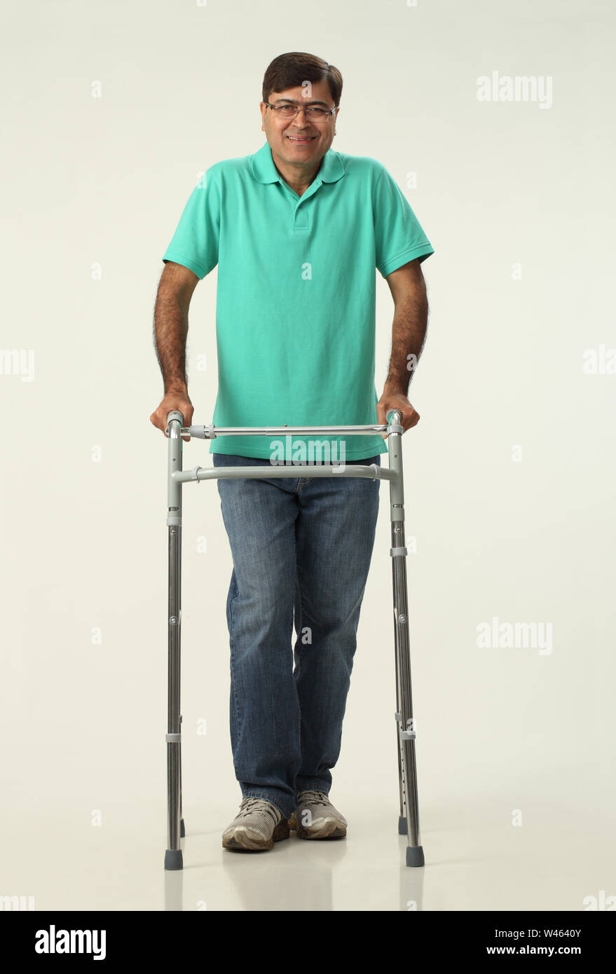 Man walking with a walker Stock Photo - Alamy