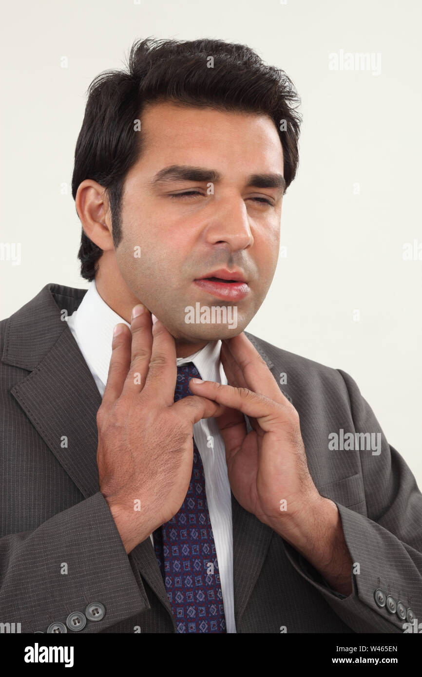 Businessman suffering from sore throat Stock Photo Alamy