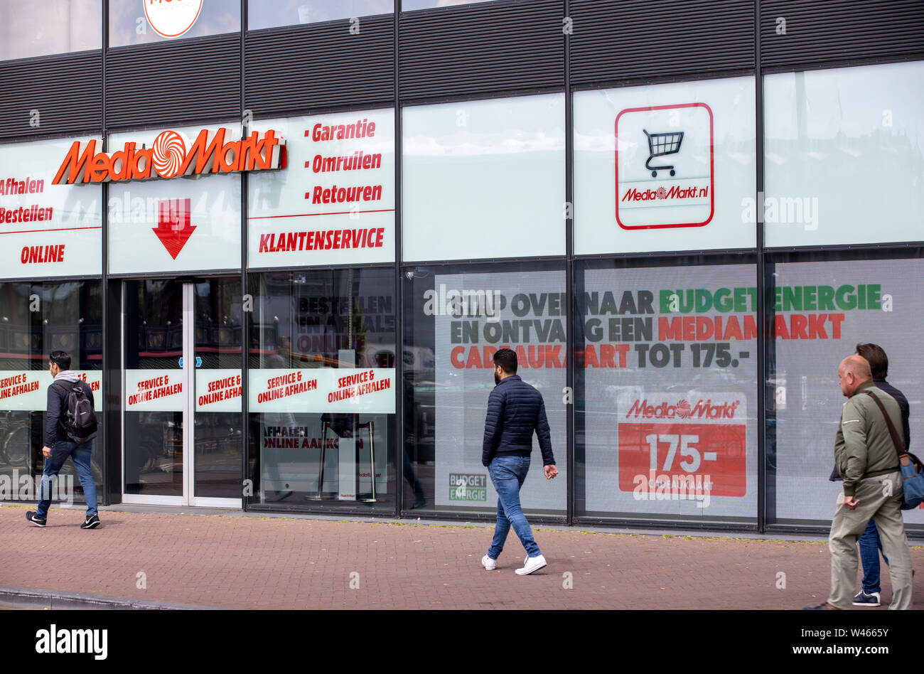 The entrance of Media markt with stickers to help people keep their  distance in Oostakker, Belgium