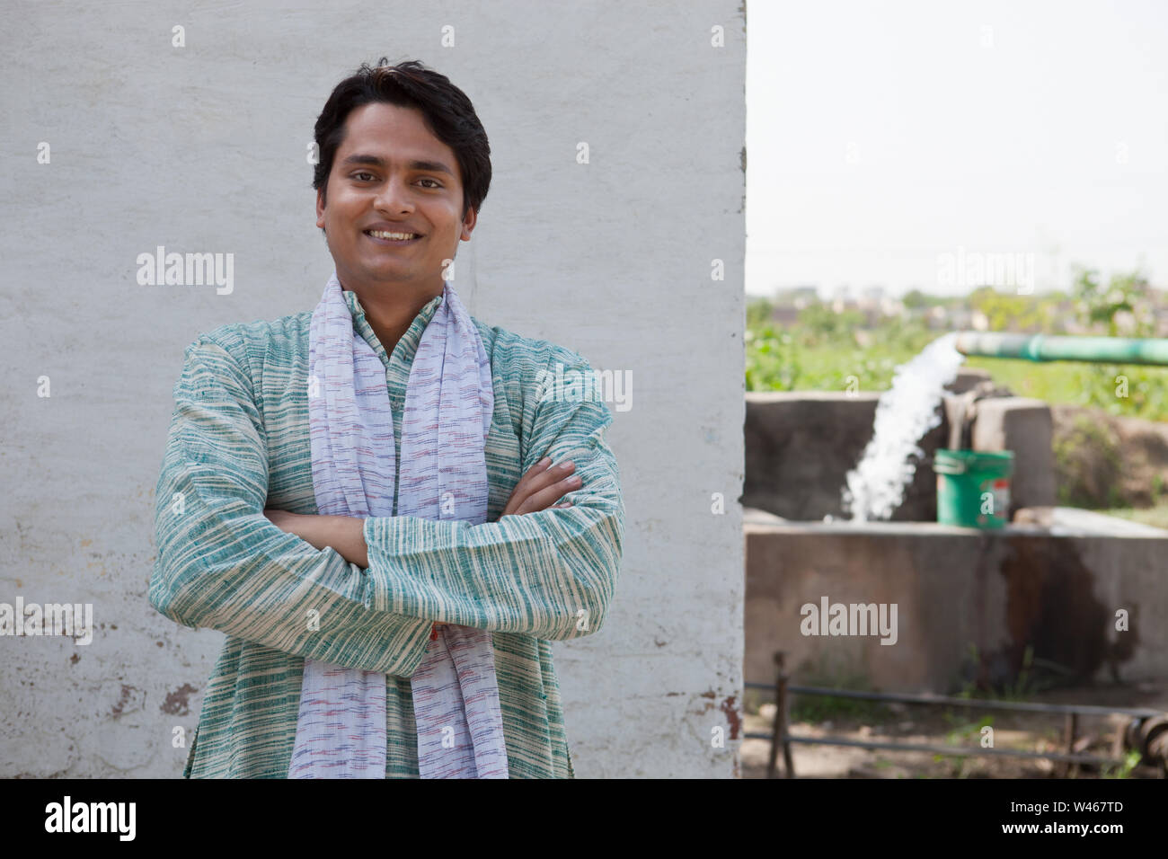 Portrait of a farmer smiling with his arms crossed Stock Photo - Alamy